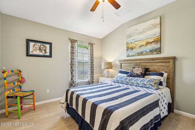 2738 Sea Grove Ln, Fernandina Beach, FL 32034 - bedroom featuring lofted ceiling, baseboards, wood finished floors, and ceiling fan