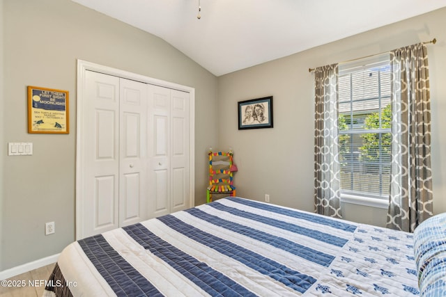 2738 Sea Grove Ln, Fernandina Beach, FL 32034 - bedroom featuring lofted ceiling, a closet, and baseboards