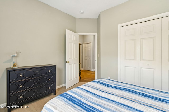 2738 Sea Grove Ln, Fernandina Beach, FL 32034 - bedroom with a closet, wood finished floors, and baseboards