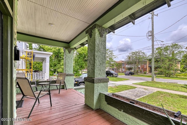2236 Post St, Jacksonville, FL 32204 - wooden deck featuring covered porch