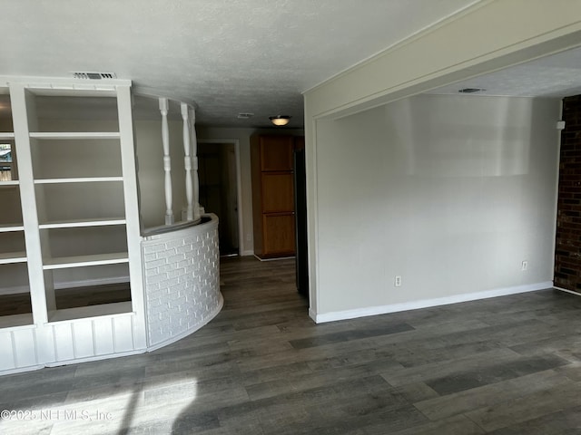 234 Canis St W, Orange Park, FL 32073 - empty room with baseboards, dark wood-style flooring, and a textured ceiling