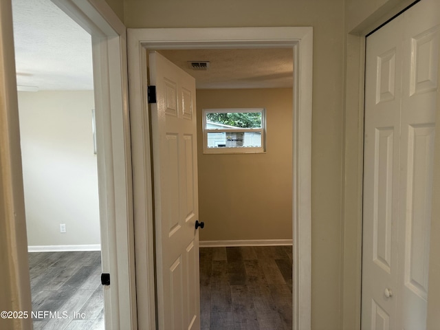 234 Canis St W, Orange Park, FL 32073 - hallway featuring dark wood-style flooring and baseboards