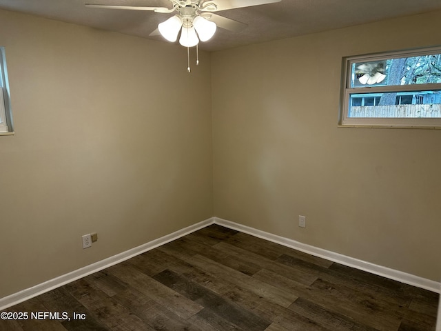 234 Canis St W, Orange Park, FL 32073 - spare room with dark wood finished floors, baseboards, and ceiling fan
