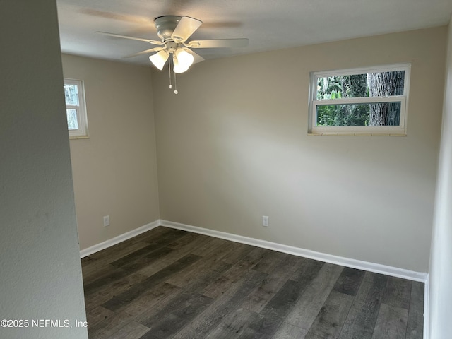 234 Canis St W, Orange Park, FL 32073 - empty room with plenty of natural light, ceiling fan, dark wood-style flooring, and baseboards