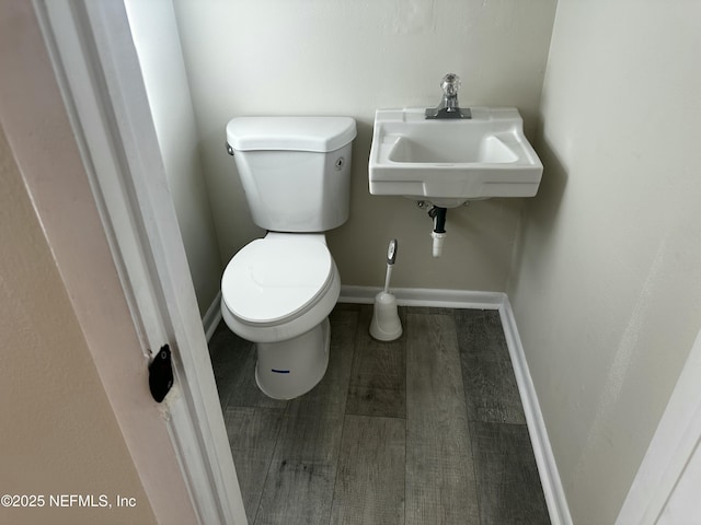 234 Canis St W, Orange Park, FL 32073 - half bath featuring baseboards, toilet, and a sink