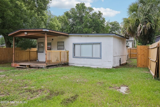 7345 Penrose St, Jacksonville, FL 32208 - rear view of house with a wooden deck