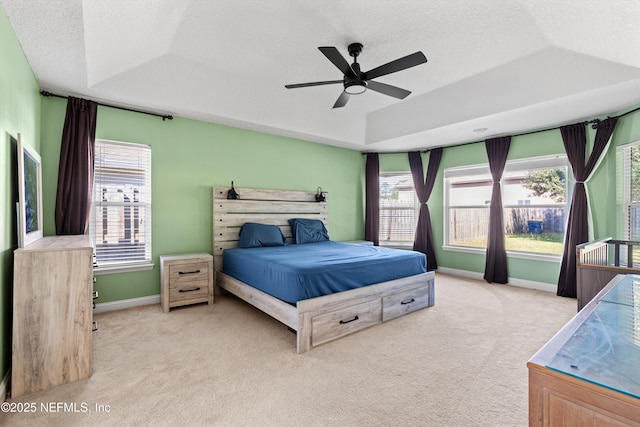 129 Lake Run Blvd, Jacksonville, FL 32218 - carpeted bedroom with baseboards, a textured ceiling, multiple windows, a raised ceiling, and a ceiling fan