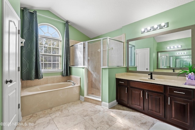 129 Lake Run Blvd, Jacksonville, FL 32218 - full bathroom with lofted ceiling, vanity, a shower stall, and a garden tub