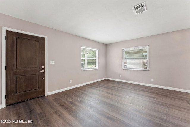 3930 Cottonwood Ln, Jacksonville, FL 32207 - spare room with dark wood-type flooring and baseboards