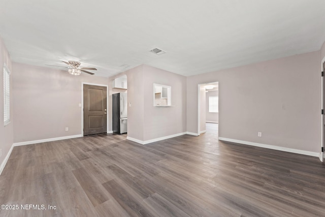 3930 Cottonwood Ln, Jacksonville, FL 32207 - unfurnished living room featuring ceiling fan, dark wood-style floors, and baseboards