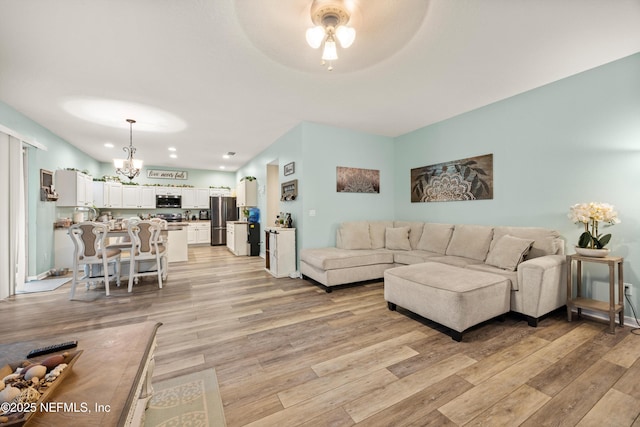 97054 Huntington Ct, Yulee, FL 32097 - living room featuring a chandelier, light wood-style flooring, ceiling fan, and recessed lighting