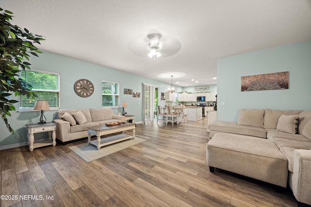 97054 Huntington Ct, Yulee, FL 32097 - living room with ceiling fan, light wood-type flooring, and baseboards