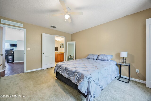97054 Huntington Ct, Yulee, FL 32097 - bedroom featuring carpet floors, baseboards, ceiling fan, and ensuite bathroom