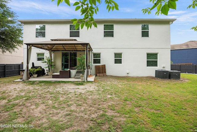 97054 Huntington Ct, Yulee, FL 32097 - back of house with a gazebo, stucco siding, a patio area, an outdoor hangout area, and cooling unit