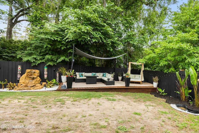 97054 Huntington Ct, Yulee, FL 32097 - fenced backyard featuring an outdoor living space and a wooden deck