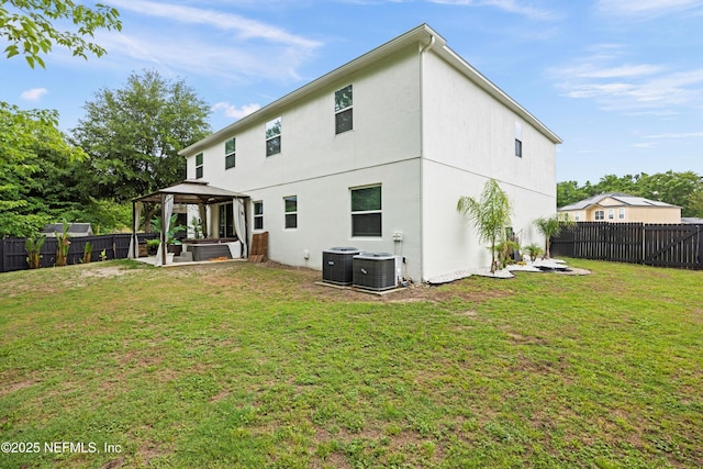 97054 Huntington Ct, Yulee, FL 32097 - rear view of property featuring a gazebo, central AC unit, and stucco siding