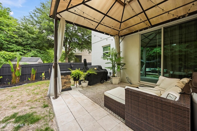 97054 Huntington Ct, Yulee, FL 32097 - view of patio featuring a gazebo, fence, and outdoor lounge area