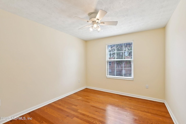 5201 Atlantic Blvd Unit 142, Jacksonville, FL 32207 - empty room with wood finished floors, a ceiling fan, baseboards, and a textured ceiling