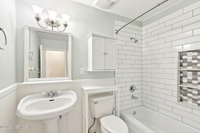 5201 Atlantic Blvd Unit 142, Jacksonville, FL 32207 - bathroom with a sink, shower / washtub combination, a wainscoted wall, and toilet