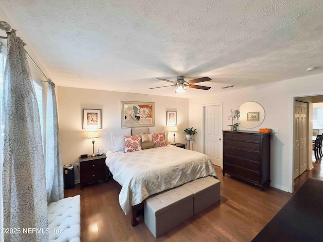 5201 Atlantic Blvd Unit 142, Jacksonville, FL 32207 - bedroom featuring wood finished floors, a textured ceiling, ceiling fan, and baseboards