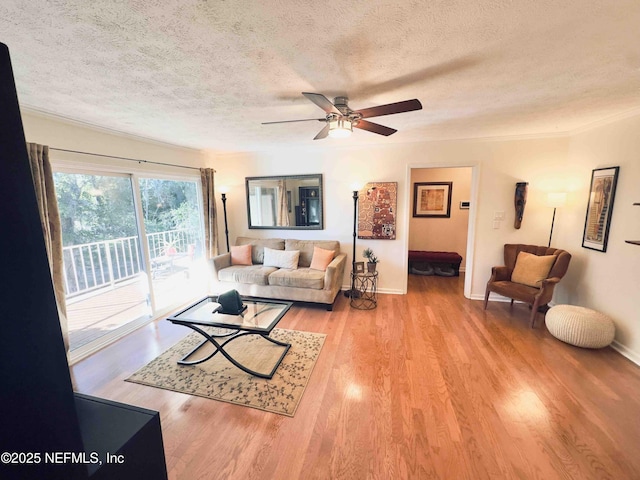 5201 Atlantic Blvd Unit 142, Jacksonville, FL 32207 - living area with a textured ceiling, wood finished floors, a ceiling fan, and baseboards