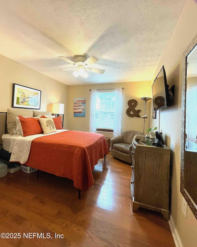 5201 Atlantic Blvd Unit 142, Jacksonville, FL 32207 - bedroom with wood finished floors, a textured ceiling, and a ceiling fan