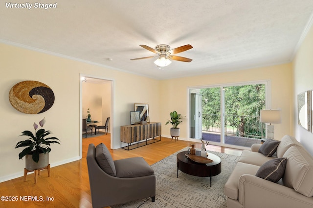 5201 Atlantic Blvd Unit 142, Jacksonville, FL 32207 - living room with wood finished floors, a ceiling fan, crown molding, and baseboards