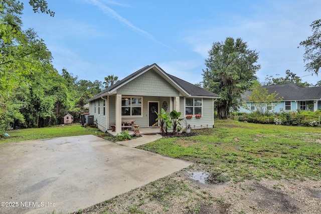 616 Osman Rd, Jacksonville, FL 32225 - view of front facade with covered porch and a front lawn