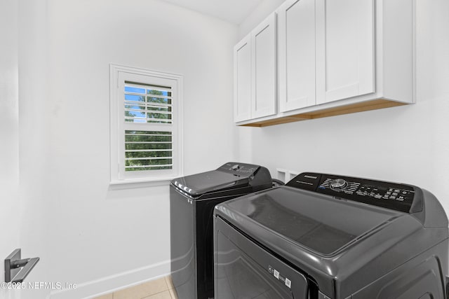 166 Spinner Dr, Ponte Vedra, FL 32081 - washroom featuring cabinet space, washing machine and dryer, baseboards, and tile patterned flooring