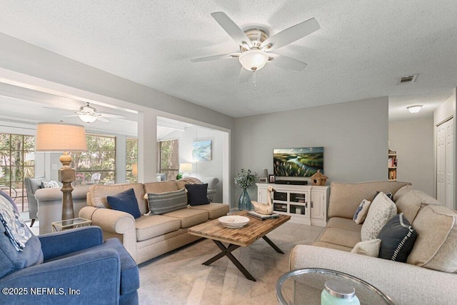 1773 Mariners Walk, Fernandina Beach, FL 32034 - living area with a ceiling fan and a textured ceiling