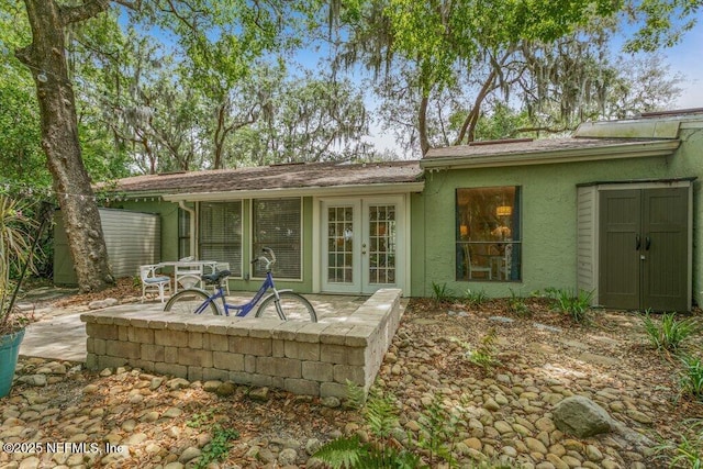1773 Mariners Walk, Fernandina Beach, FL 32034 - rear view of house featuring french doors, a patio area, and stucco siding