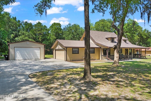 4310 Chokeberry Rd, Middleburg, FL 32068 - view of front of house featuring a detached garage, covered porch, and an outdoor structure