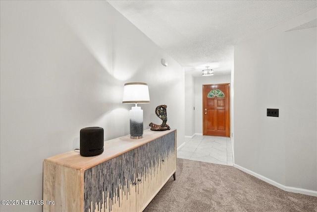 4310 Chokeberry Rd, Middleburg, FL 32068 - hallway with a textured ceiling, light colored carpet, and baseboards