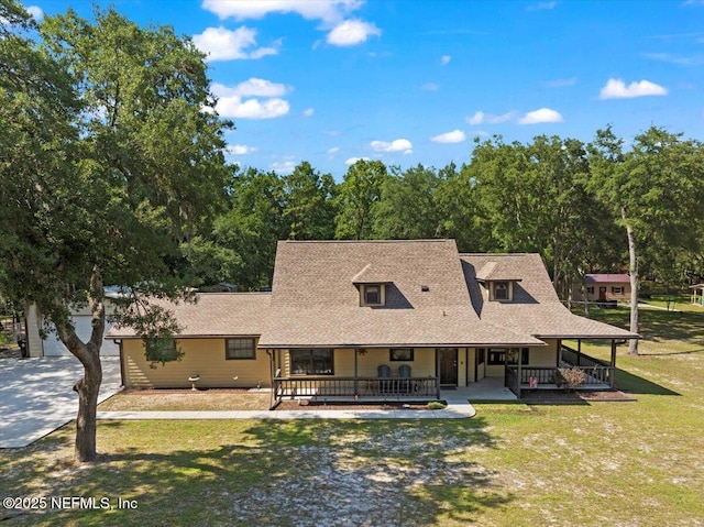 4310 Chokeberry Rd, Middleburg, FL 32068 - back of house with covered porch, driveway, a yard, and a shingled roof