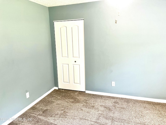 4310 Chokeberry Rd, Middleburg, FL 32068 - unfurnished bedroom with carpet and baseboards