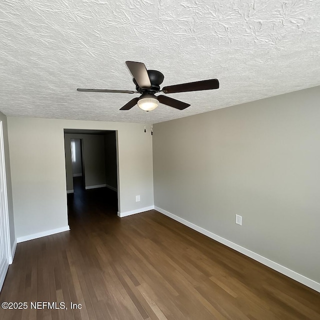1109 Lake Shore Blvd, Jacksonville, FL 32205 - unfurnished room featuring dark wood finished floors, a ceiling fan, baseboards, and a textured ceiling