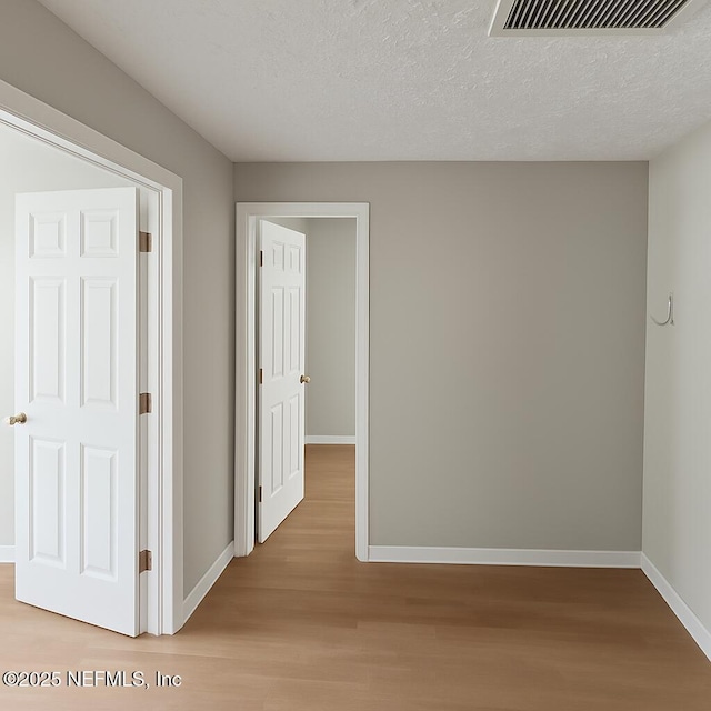 1109 Lake Shore Blvd, Jacksonville, FL 32205 - hall featuring wood finished floors, baseboards, and a textured ceiling