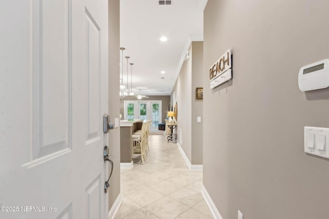95282 Summerwoods Cir Unit 608, Fernandina Beach, FL 32034 - corridor featuring light tile patterned floors, baseboards, recessed lighting, and crown molding