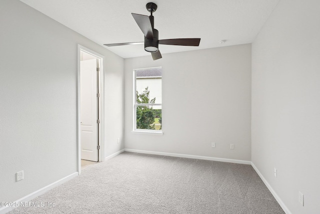 124 Medio Dr, Saint Augustine, FL 32095 - unfurnished bedroom featuring carpet flooring, baseboards, and ceiling fan