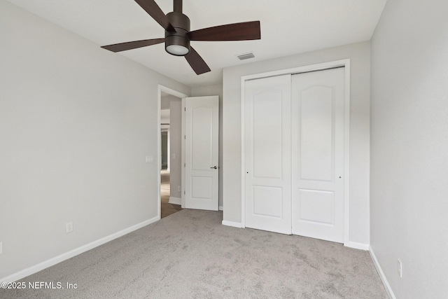124 Medio Dr, Saint Augustine, FL 32095 - unfurnished bedroom with carpet, baseboards, a closet, and ceiling fan