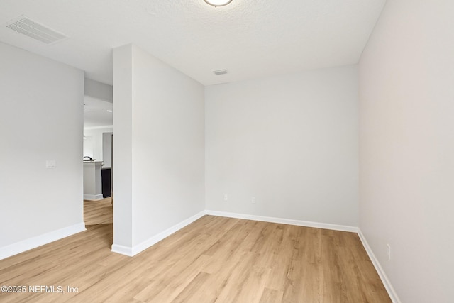 124 Medio Dr, Saint Augustine, FL 32095 - spare room featuring light wood finished floors and baseboards