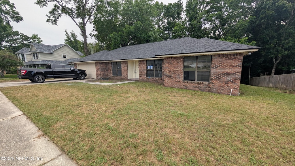 12576 Dunraven Trl, Jacksonville, FL 32223 - single story home featuring a garage, driveway, brick siding, and a shingled roof