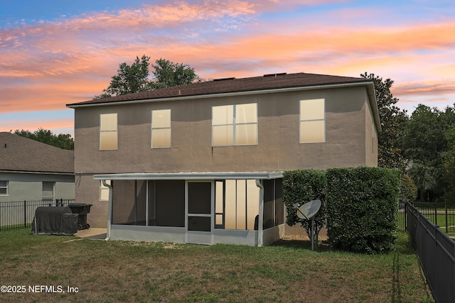 76466 Long Leaf Loop, Yulee, FL 32097 - rear view of house featuring a sunroom and stucco siding