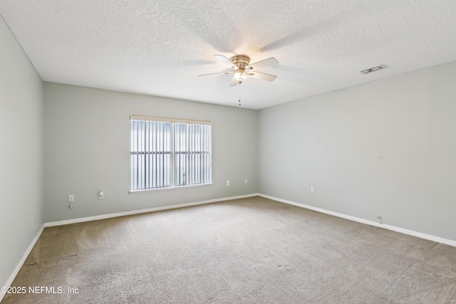 76466 Long Leaf Loop, Yulee, FL 32097 - carpeted spare room with a ceiling fan, baseboards, and a textured ceiling