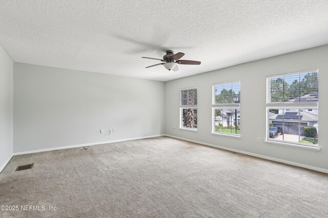 76466 Long Leaf Loop, Yulee, FL 32097 - spare room featuring ceiling fan, carpet floors, a textured ceiling, and baseboards