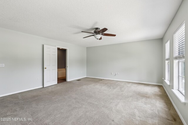 76466 Long Leaf Loop, Yulee, FL 32097 - empty room featuring a ceiling fan, carpet flooring, baseboards, and a textured ceiling
