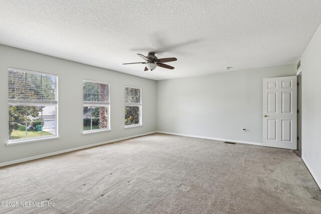 76466 Long Leaf Loop, Yulee, FL 32097 - carpeted empty room with a ceiling fan, a textured ceiling, and baseboards