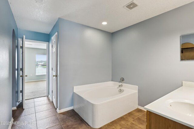 76466 Long Leaf Loop, Yulee, FL 32097 - bathroom with a bath, baseboards, and vanity
