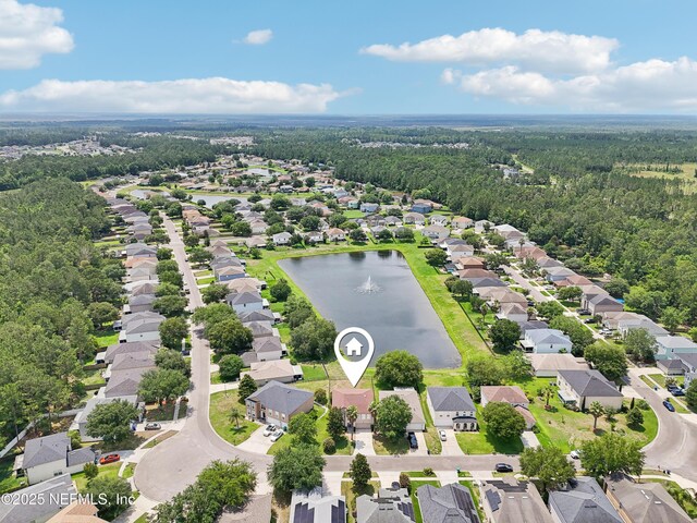 76466 Long Leaf Loop, Yulee, FL 32097 - aerial perspective of suburban area with a forest and a nearby body of water