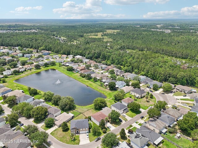 76466 Long Leaf Loop, Yulee, FL 32097 - aerial perspective of suburban area with a heavily wooded area and a nearby body of water